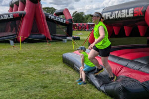 Bouncing for a Good Cause: Anna and Reuben Take on the Inflatable 2.5k!