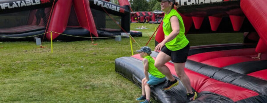 Bouncing for a Good Cause: Anna and Reuben Take on the Inflatable 2.5k!